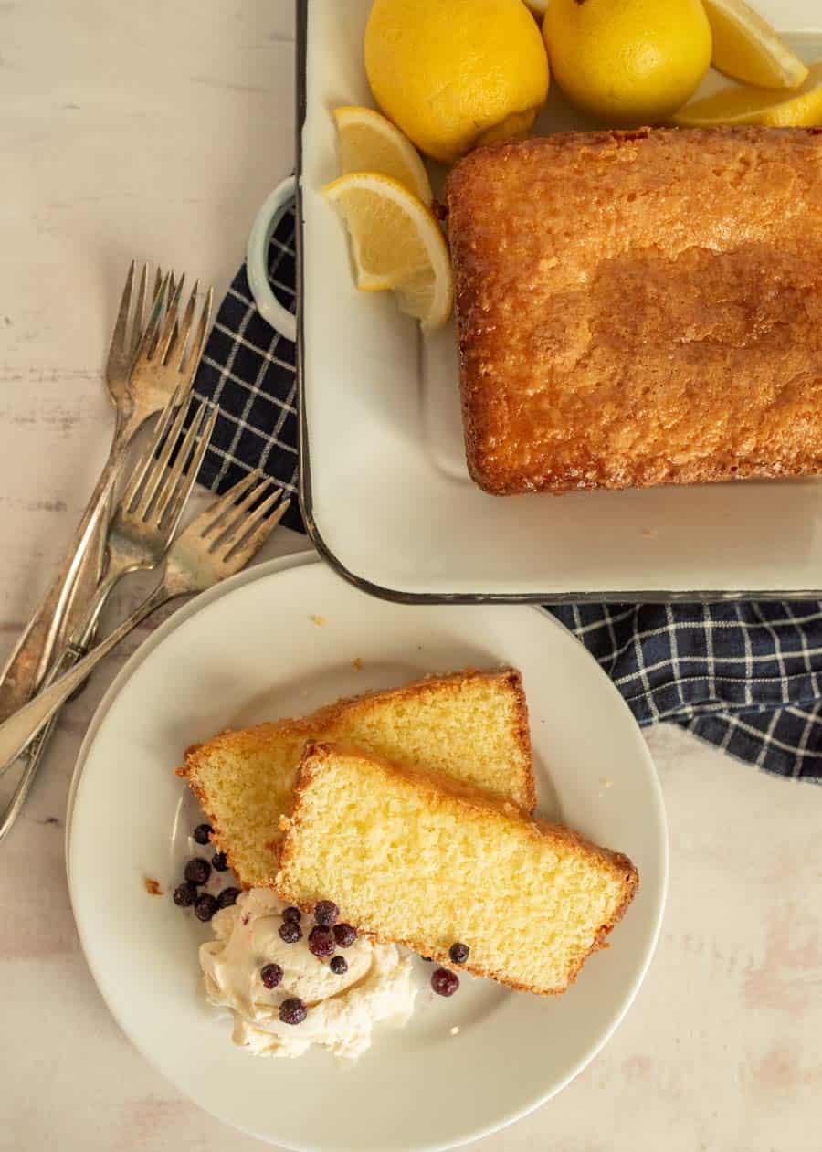 top view of Lemon pound cake slices on a plate with ice cream and a lemon pound cake loaf