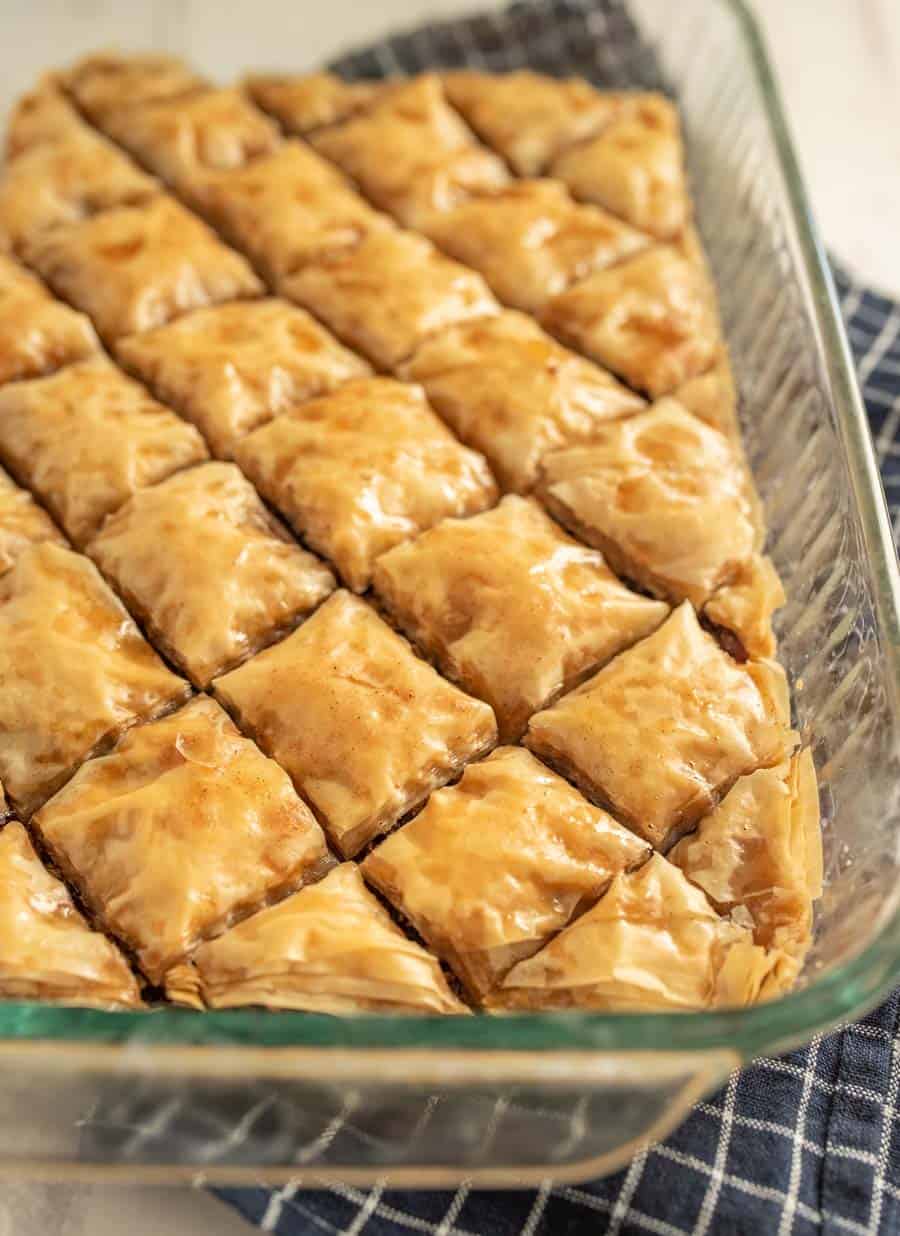A close up of baklava in a glass baking dish.