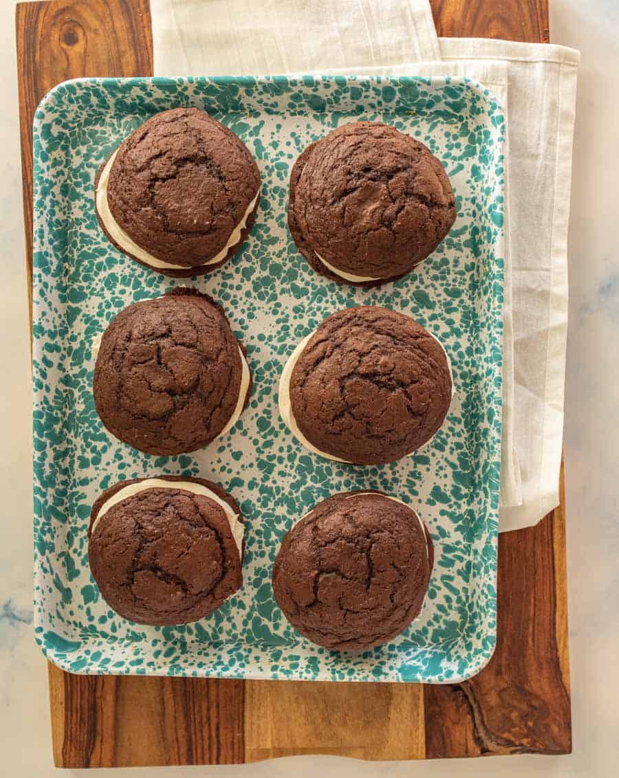 A top view of a teal spotted tray of 6 whoope pies.