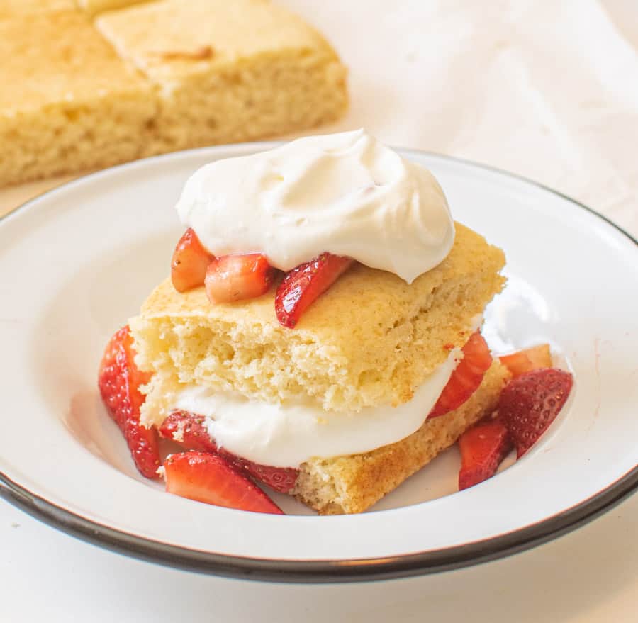 strawberries on a dense shortbread crust and whipped cream.