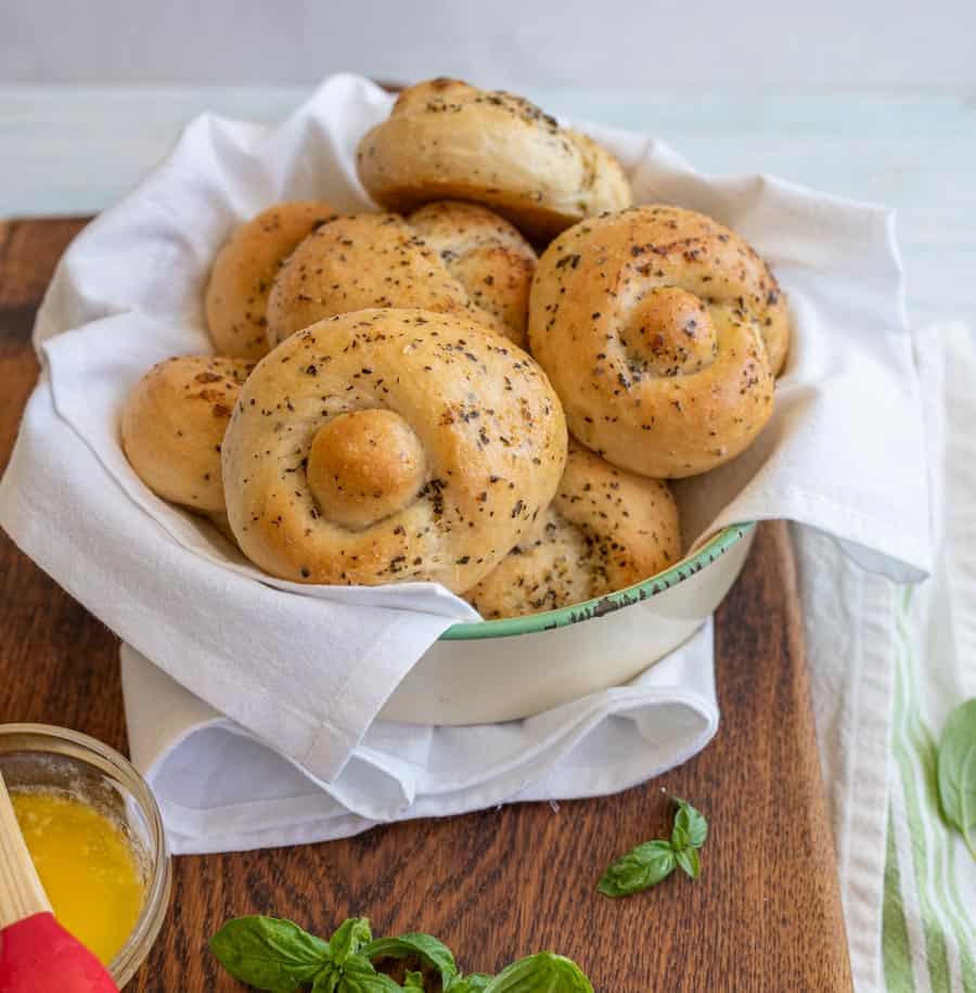 bowl of garlic knots lined with a white linen.