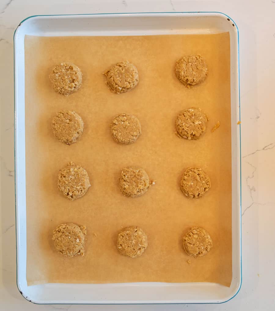 top view of baking sheet of oatmeal peanut butter cookie dough on a baking sheet
