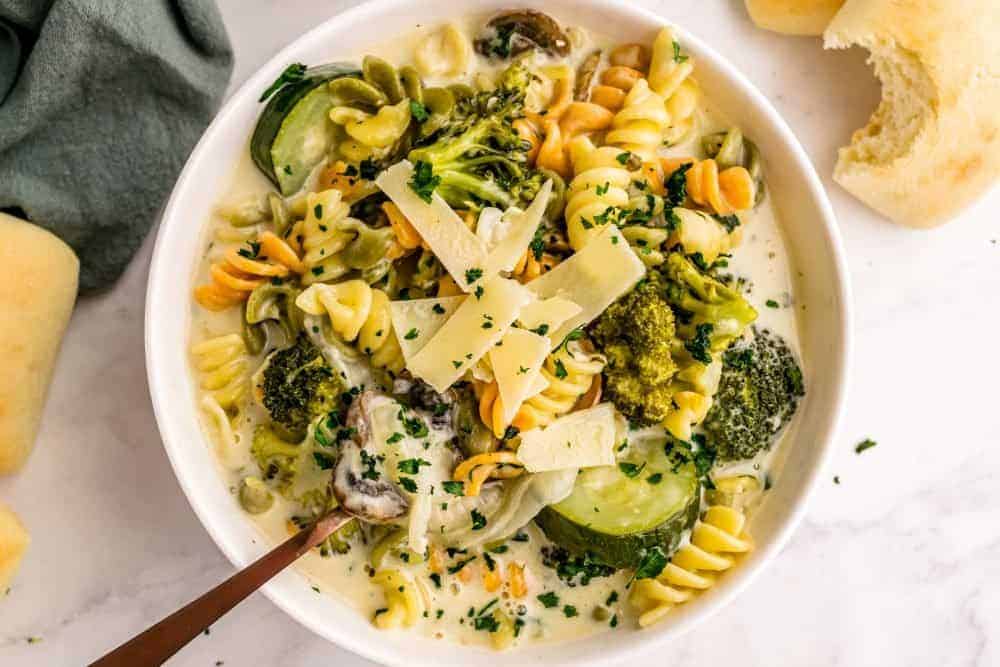A top view of a bowl of pasta primavera.