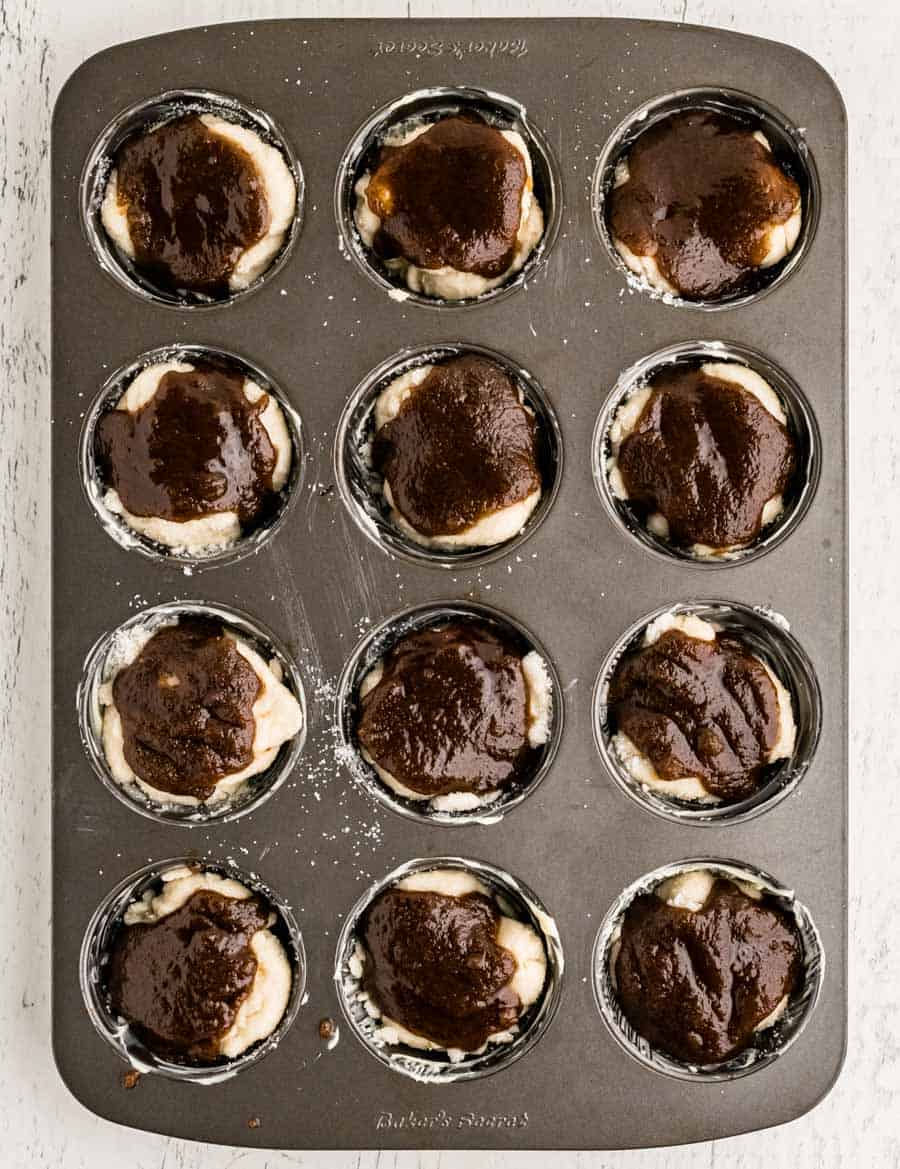 monkey bread muffin batter in a muffin tin