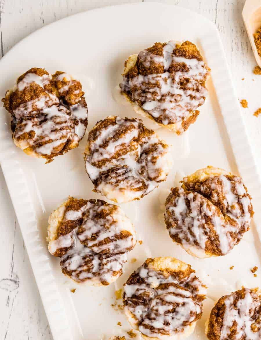Top view of monkey bread muffins on a white platter.