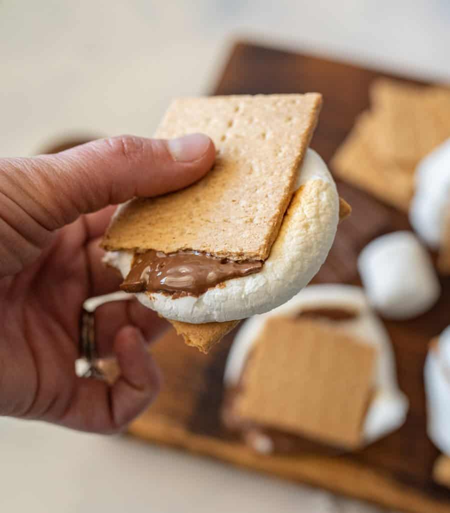 hand holding a smores.
