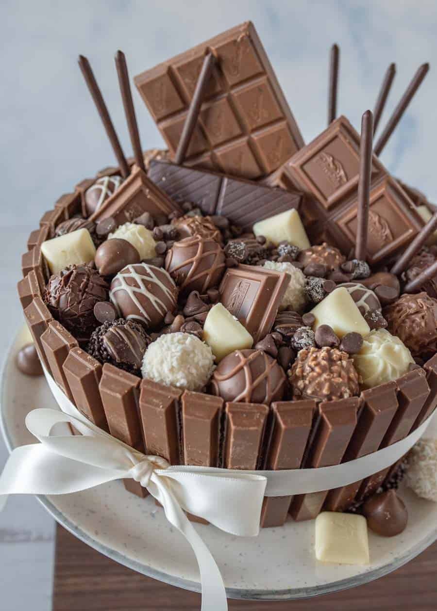 chocolate candy cake with a ribbon around it.