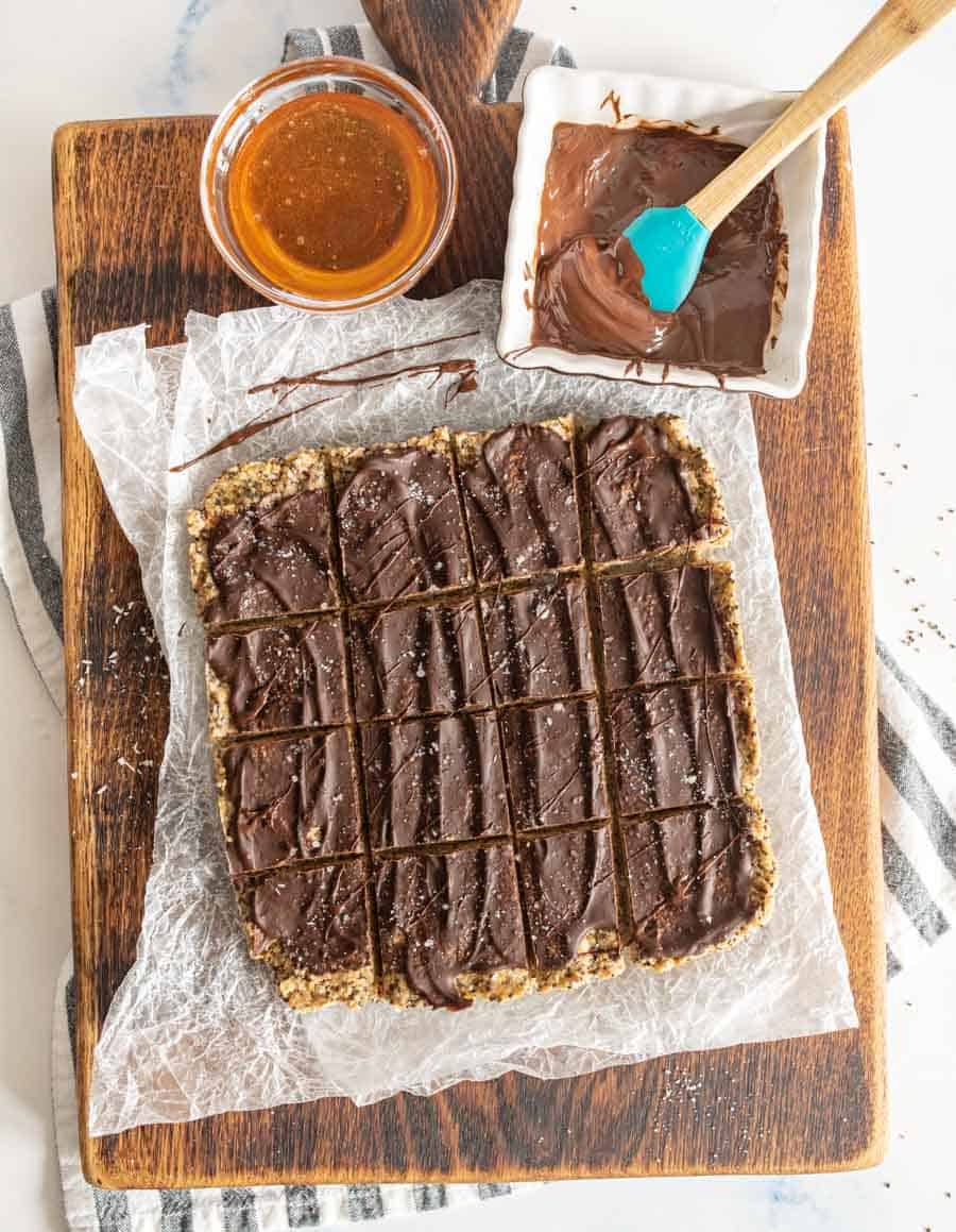 healthy protein snack bars on parchment paper covered cutting board