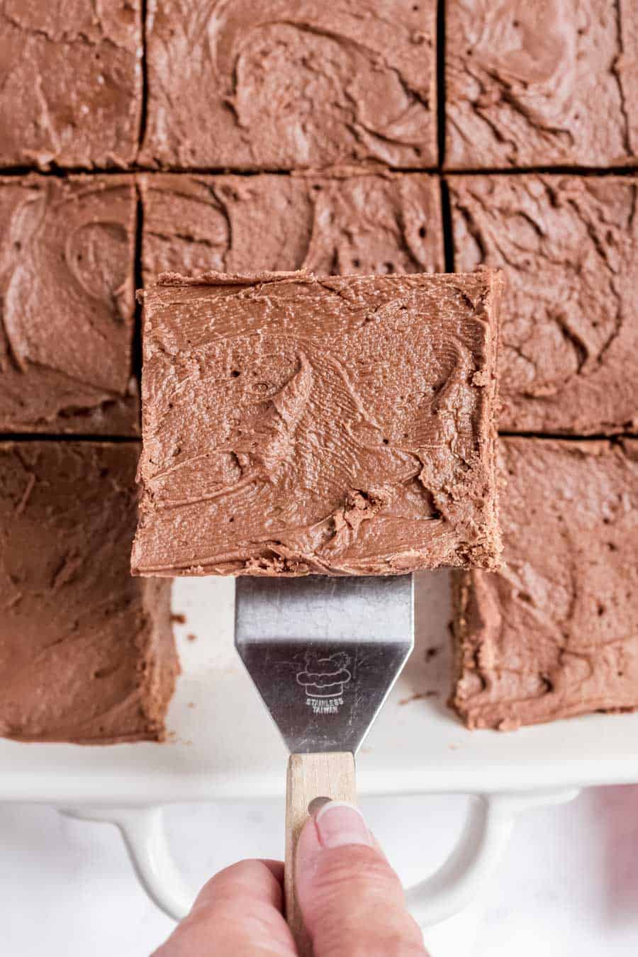Top view of a brownie being scooped out of the pan.