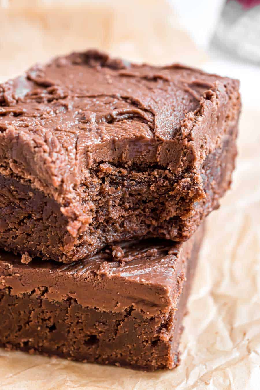 Close up view of a brownie with a bite taken out of it.