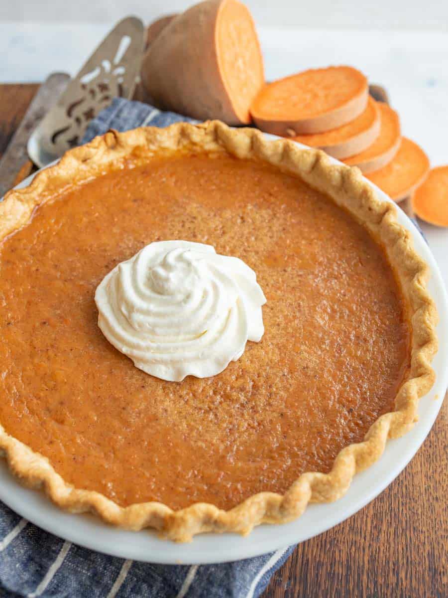 Sweet potato pie with a dollop if whipped cream.