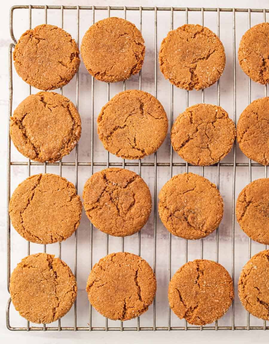 Top view of gingersnap cookies on baking rack.