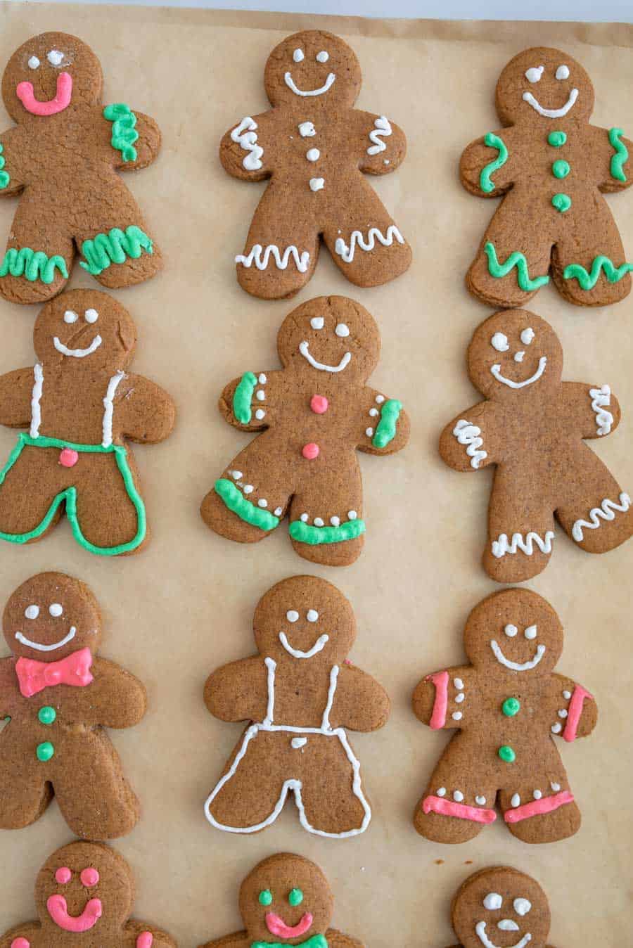 Up close top view of a pan of decorated vegan gingerbread cookies.