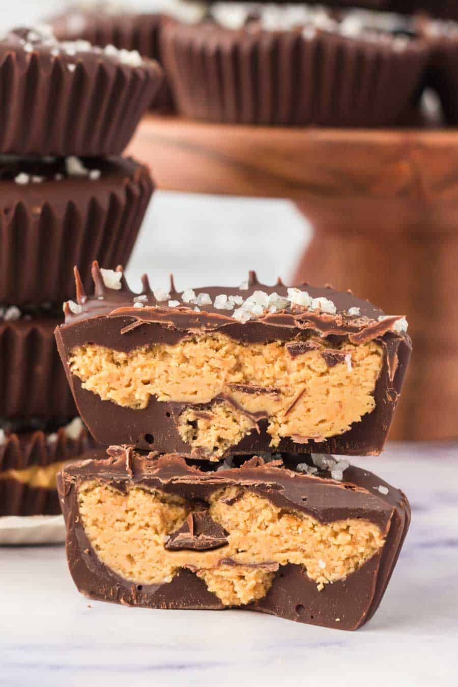 cross section of two homemade chocolate peanut butter cups.