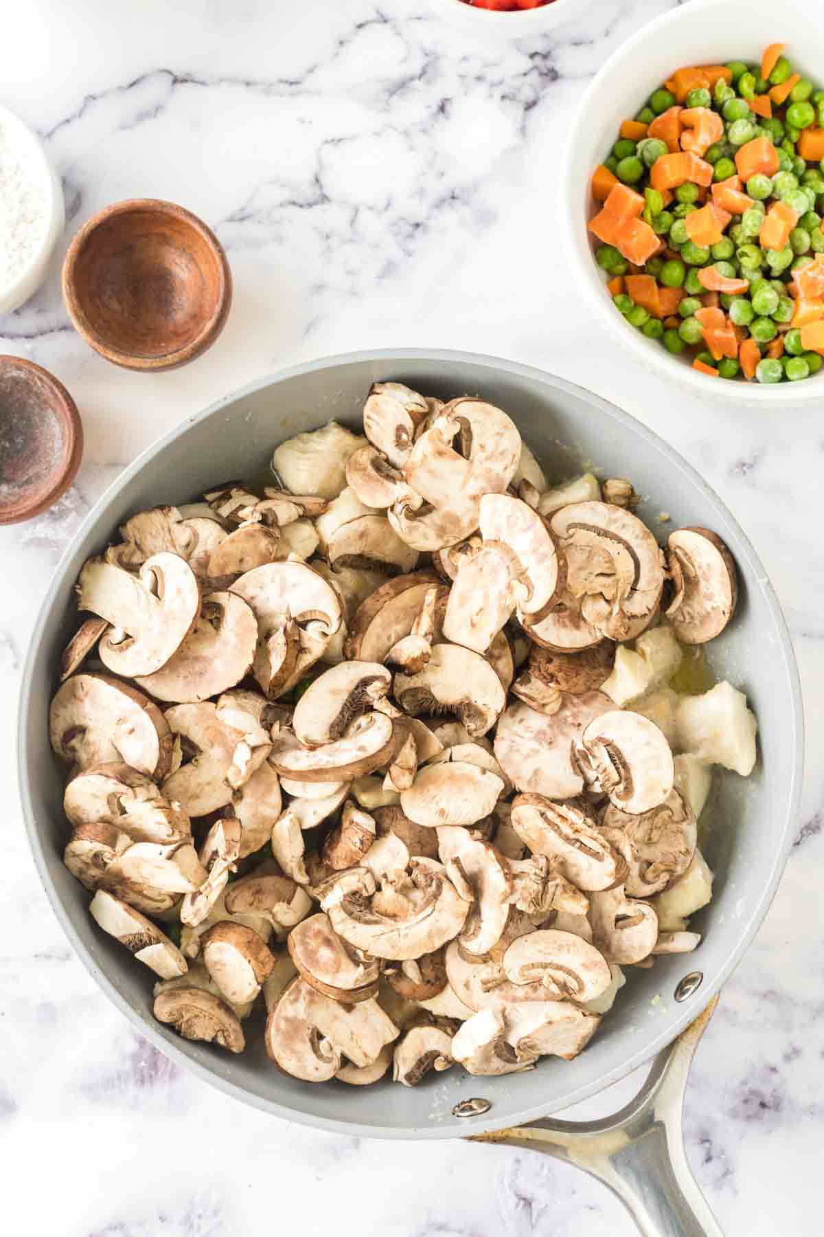 Mushrooms in the pan for chicken a la king.