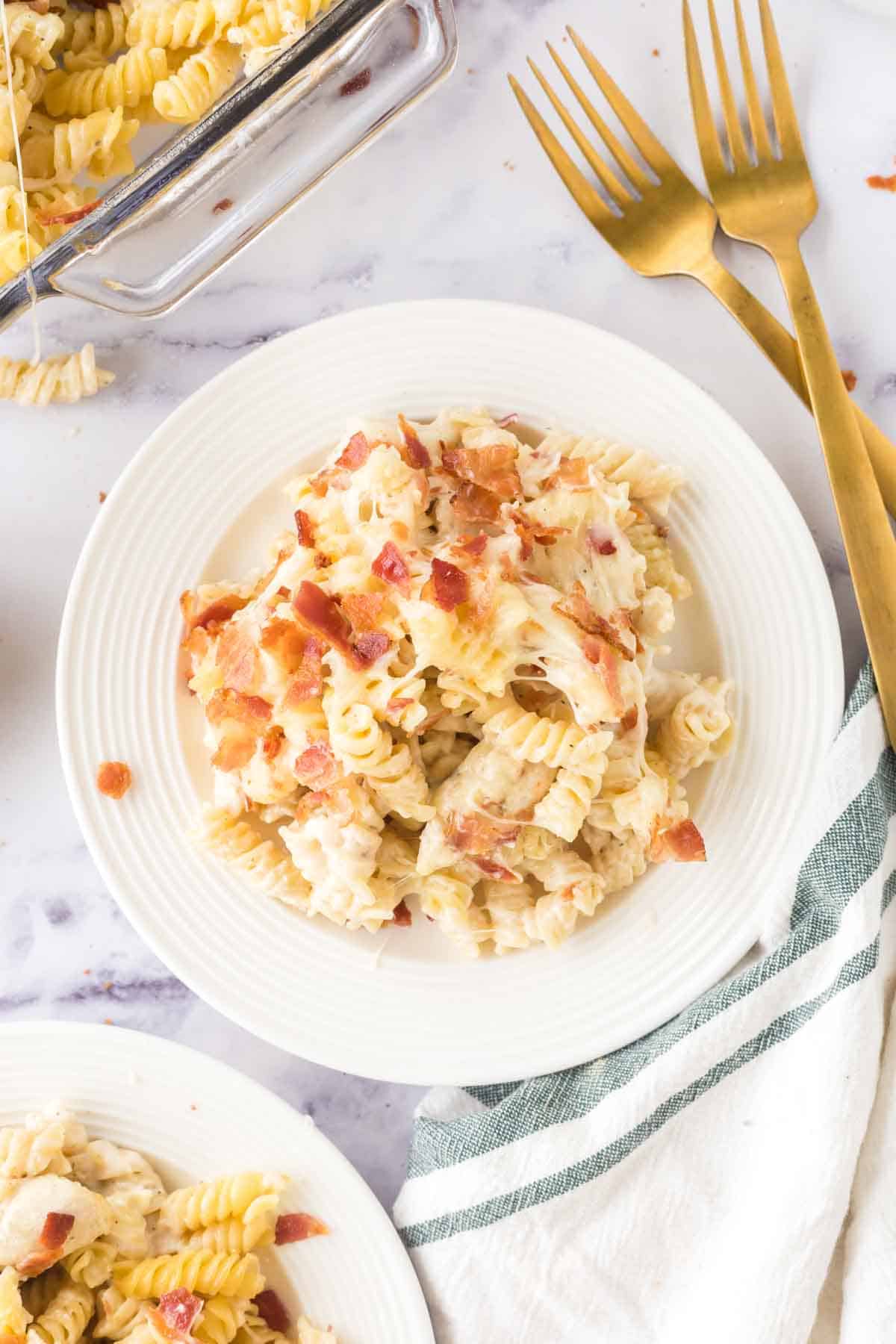 Chicken bacon ranch casserole served on a white plate.