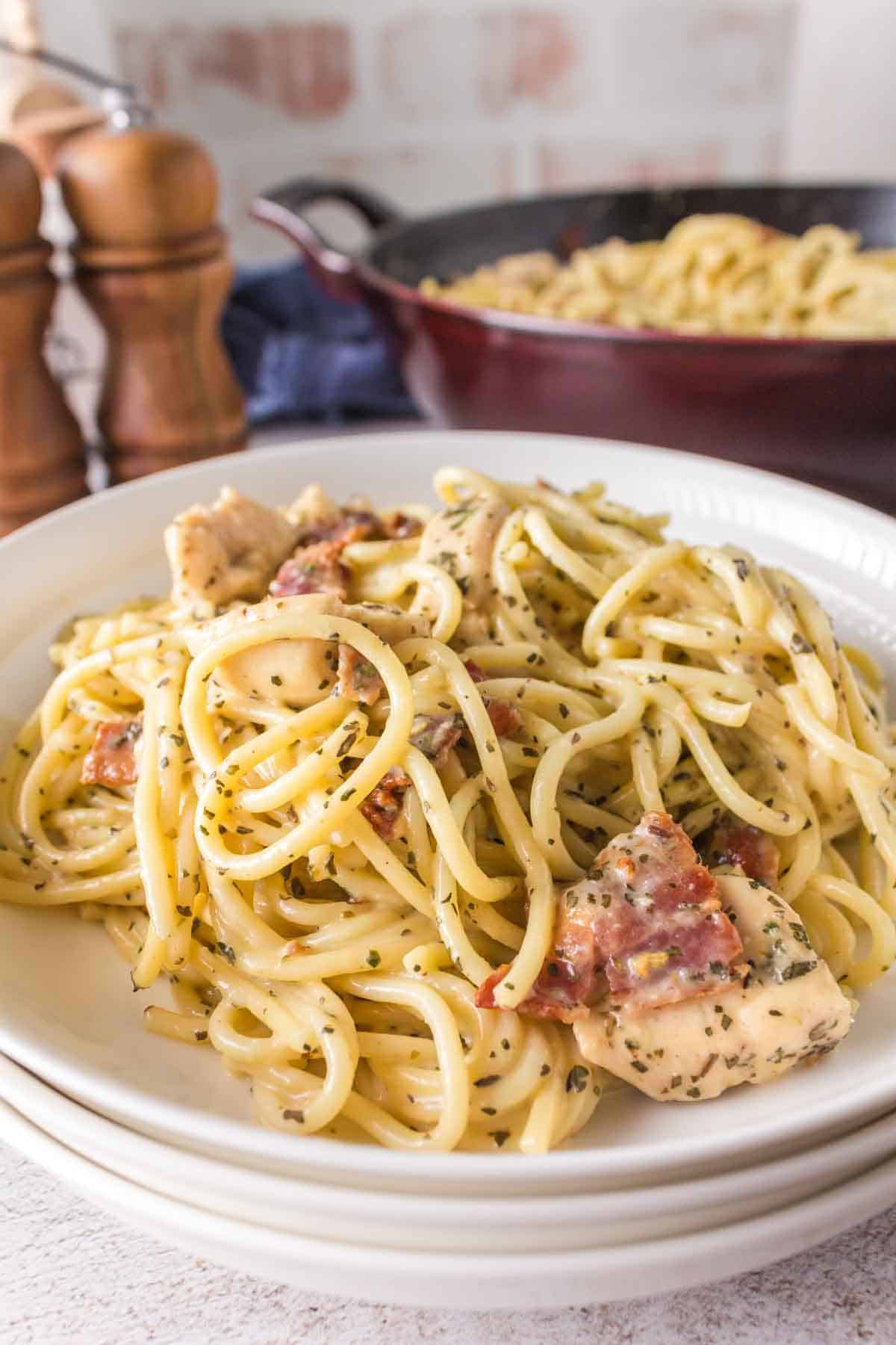Chicken carbonara served on a plate.