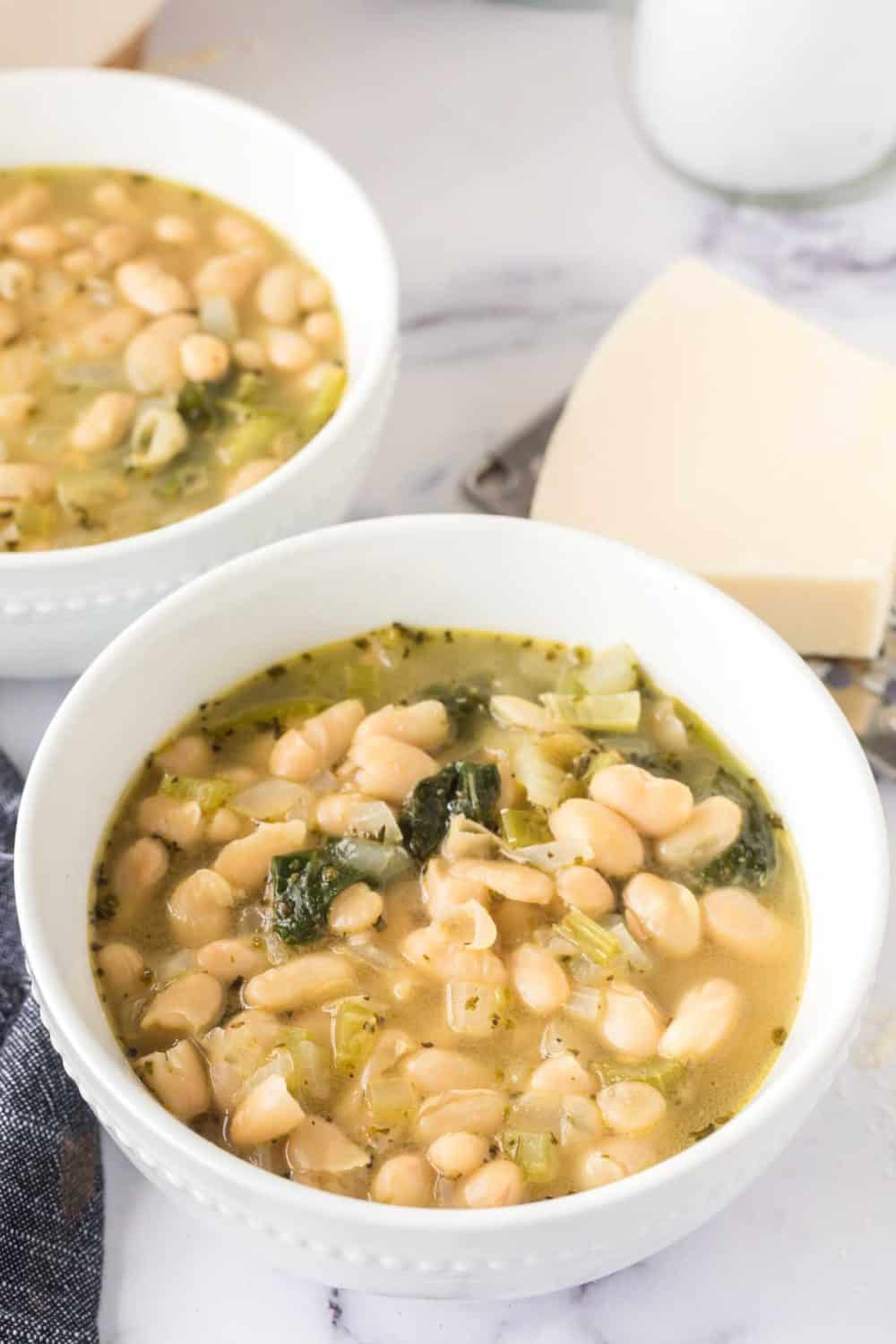 White bean soup in white bowls.