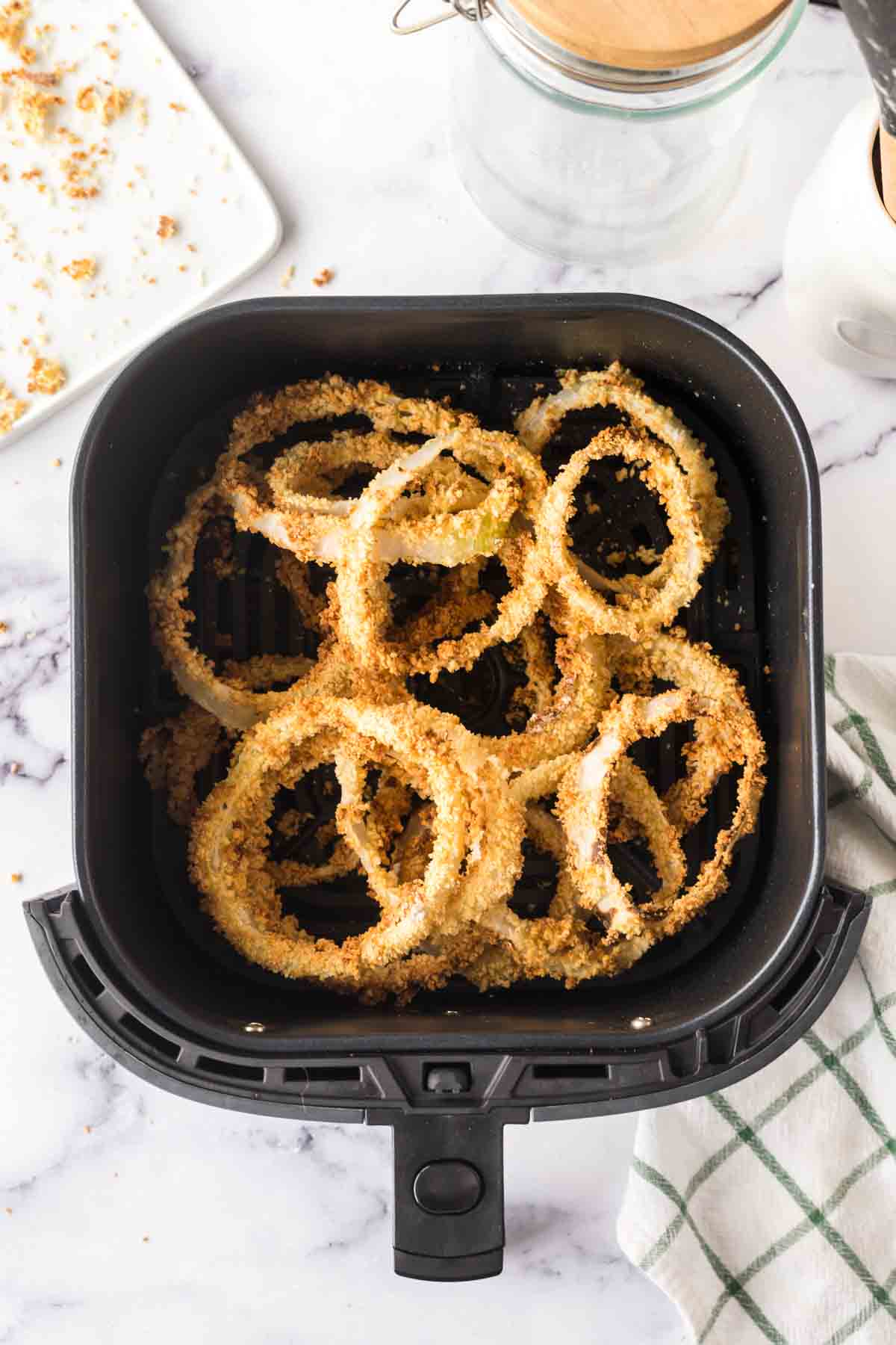 onion rings in the air fryer basket.