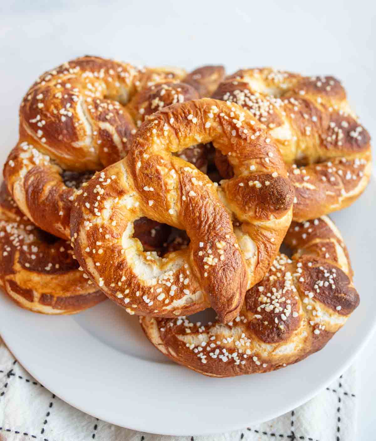Stack of homemade pretzels on a plate.