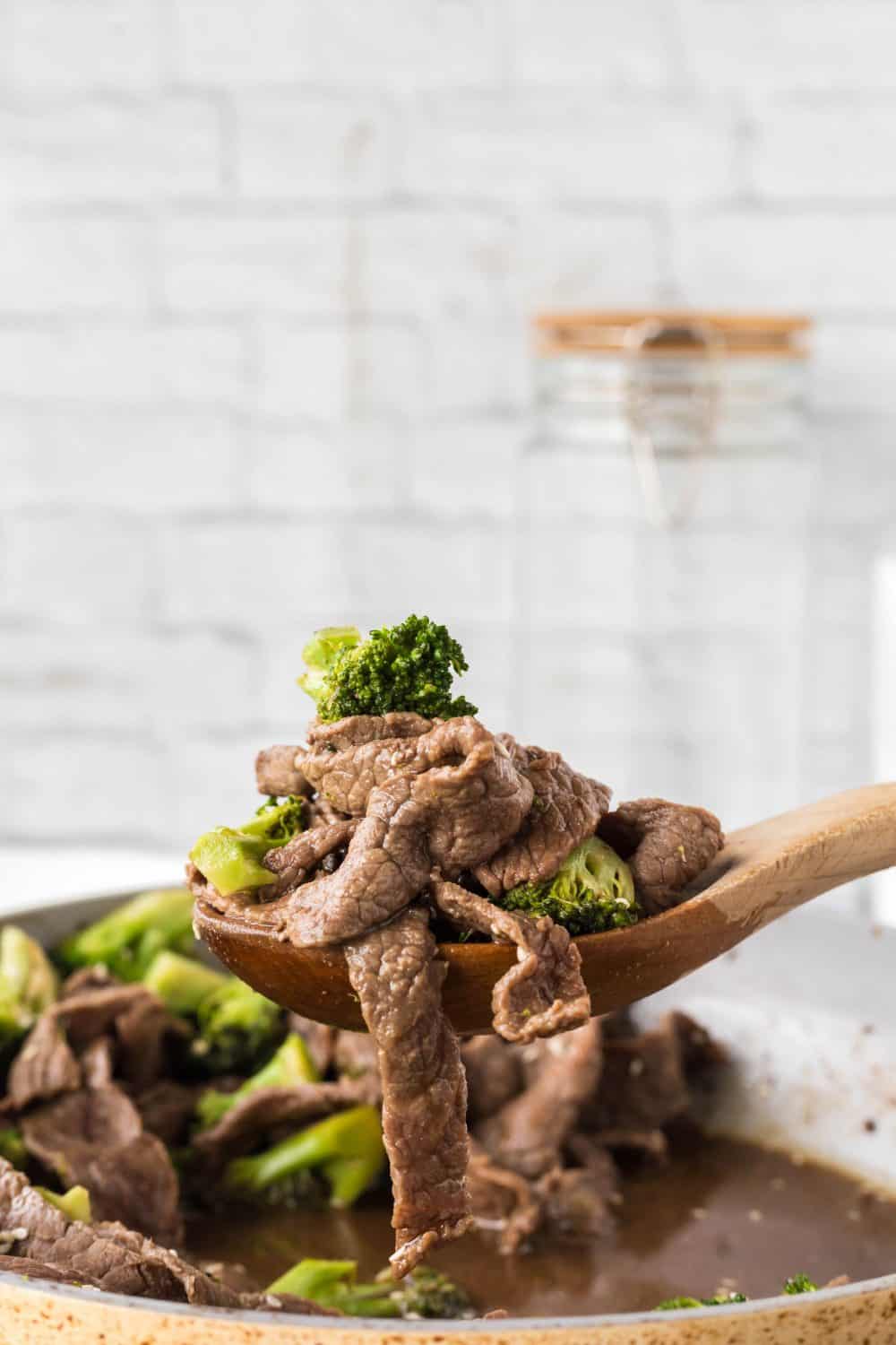 Spoonful of beef and broccoli stirfry.