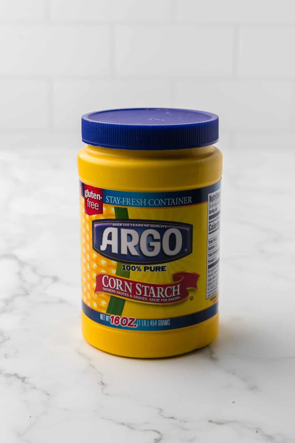 yellow container full of corn starch.