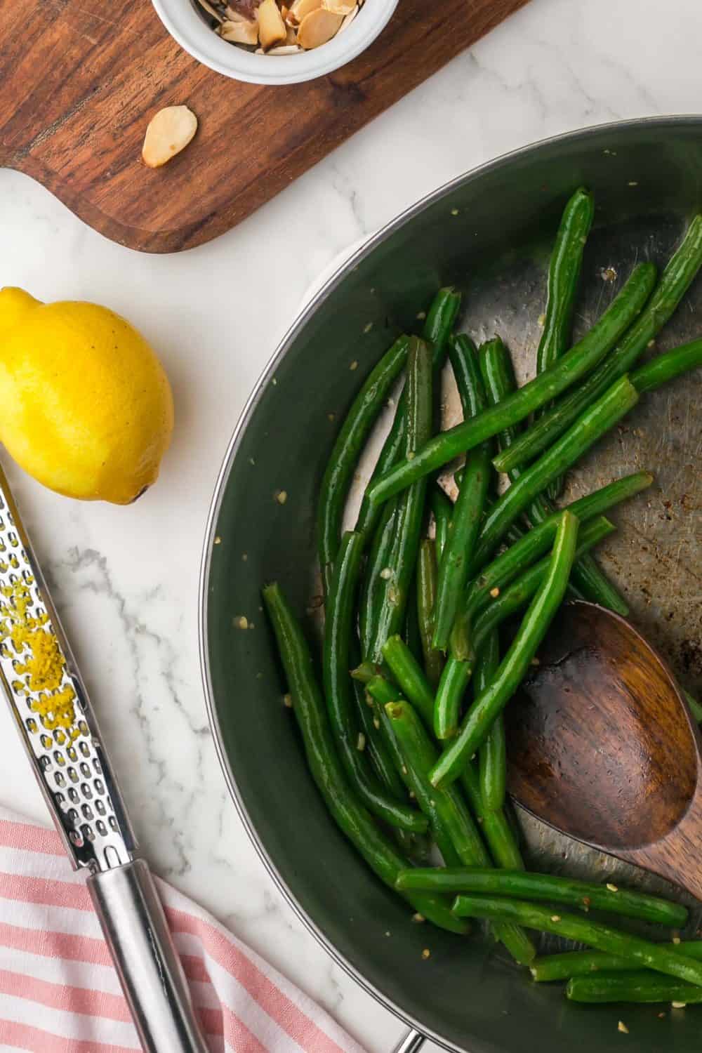 a pan for sautéed green beans and lemon zest