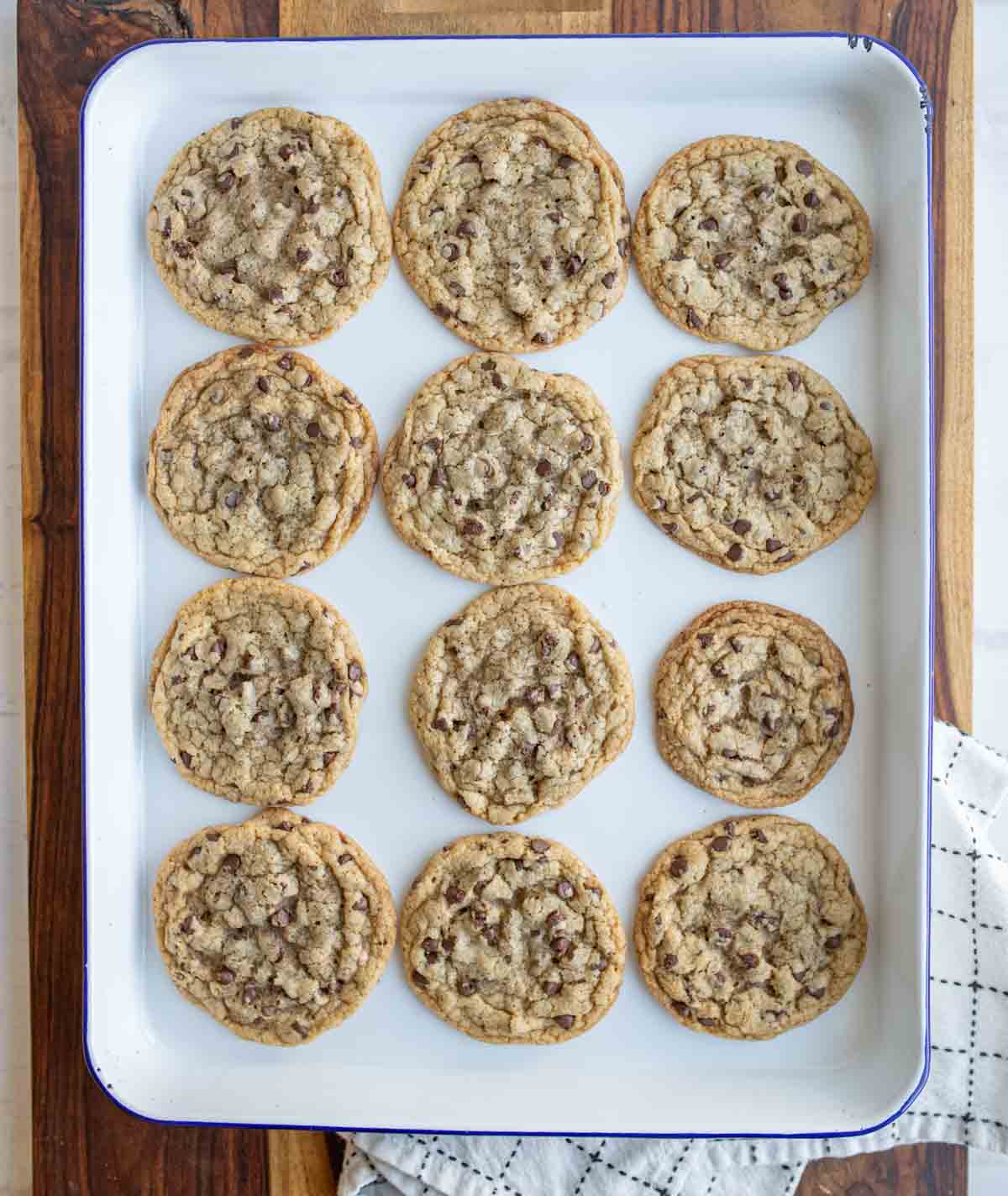 baking sheet with rows of baked brown butter chocolate chip cookies.