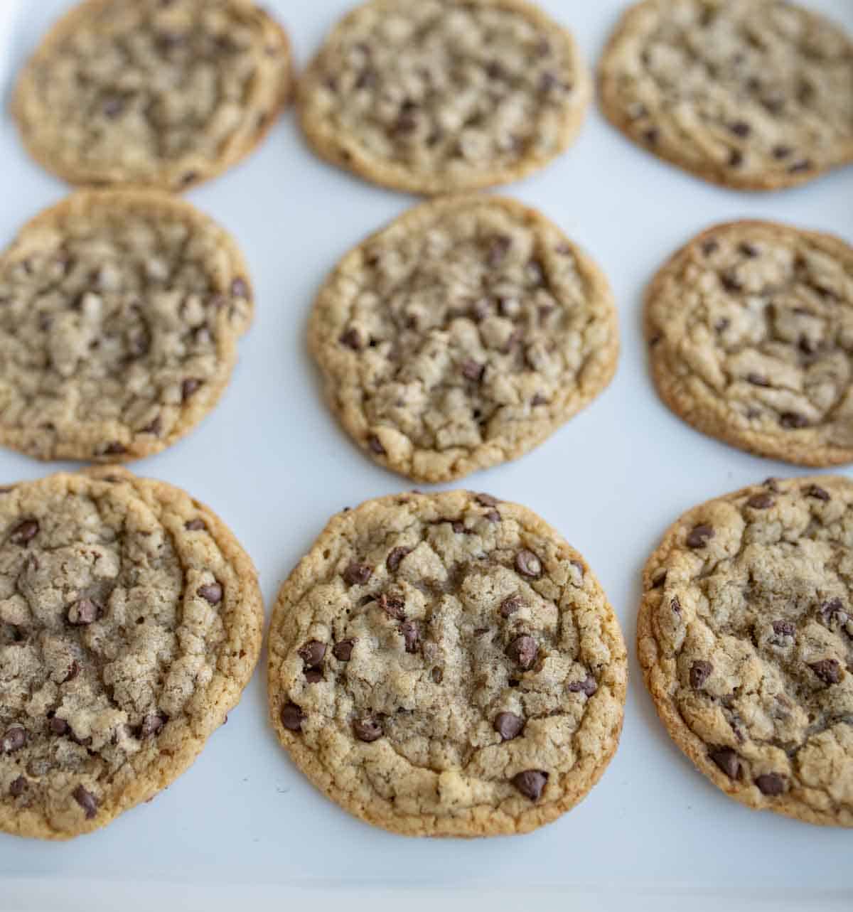 close up of brown butter chocolate chip cookies on a baking dish.