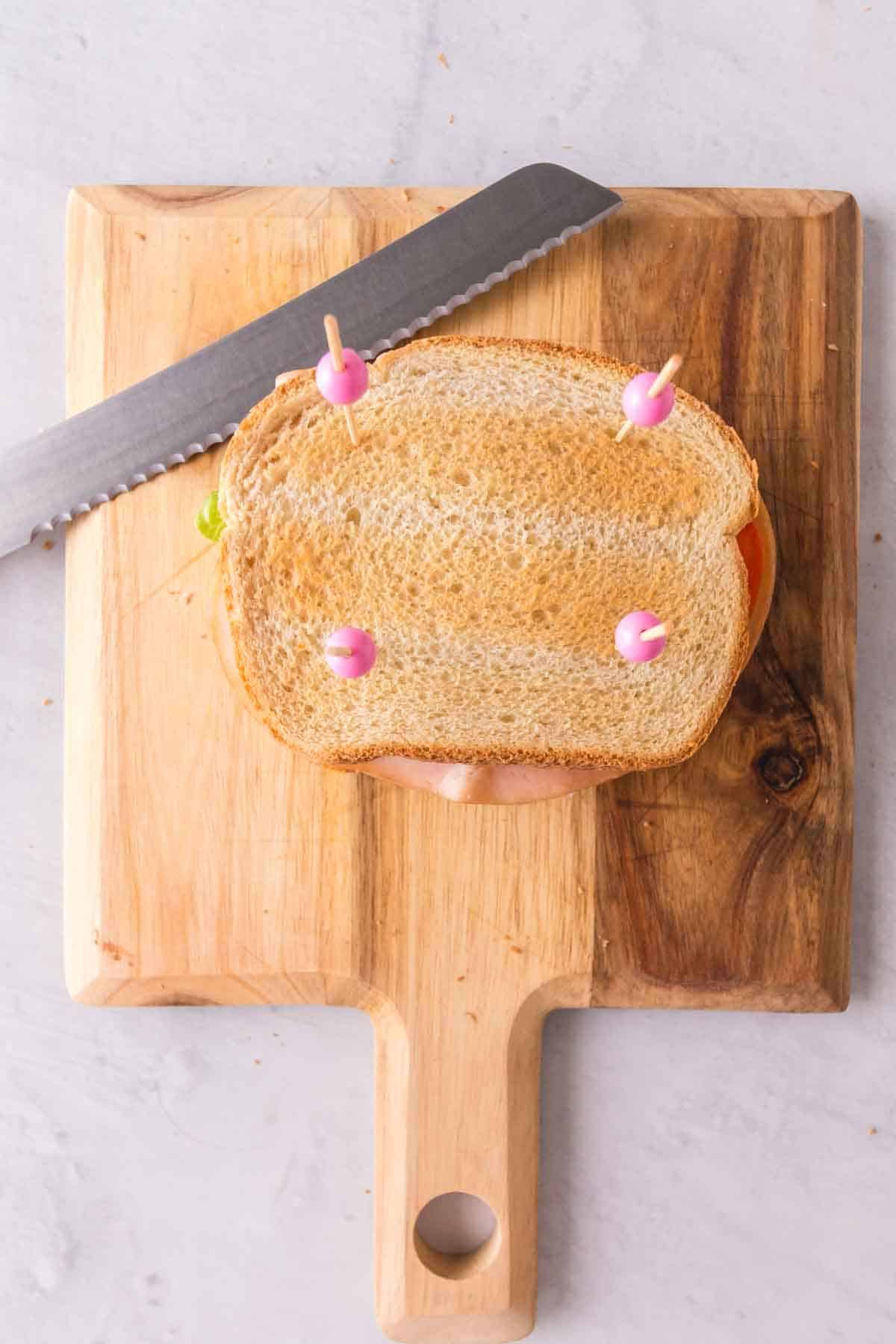 Toothpicks holding the whole sandwich together.