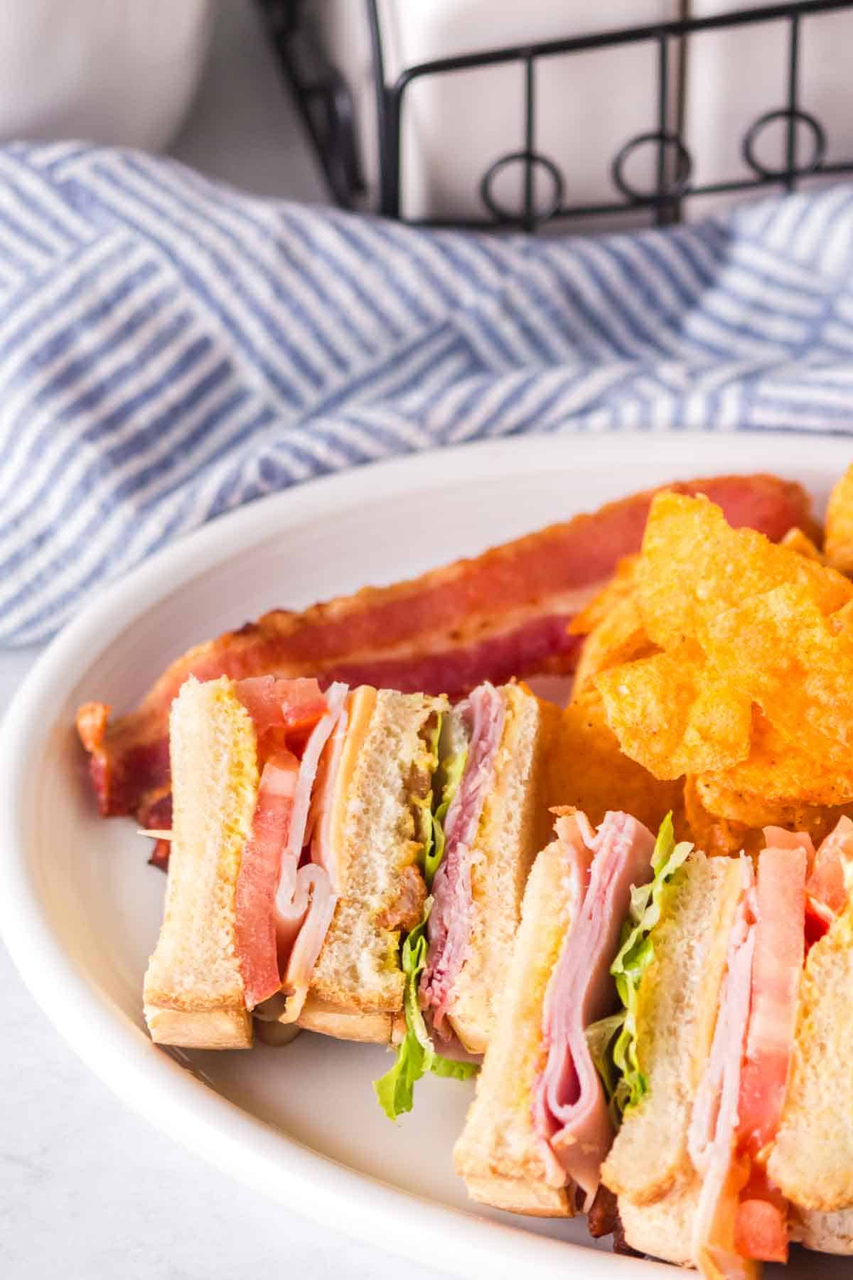 Club sandwich cut and ready to be eaten.