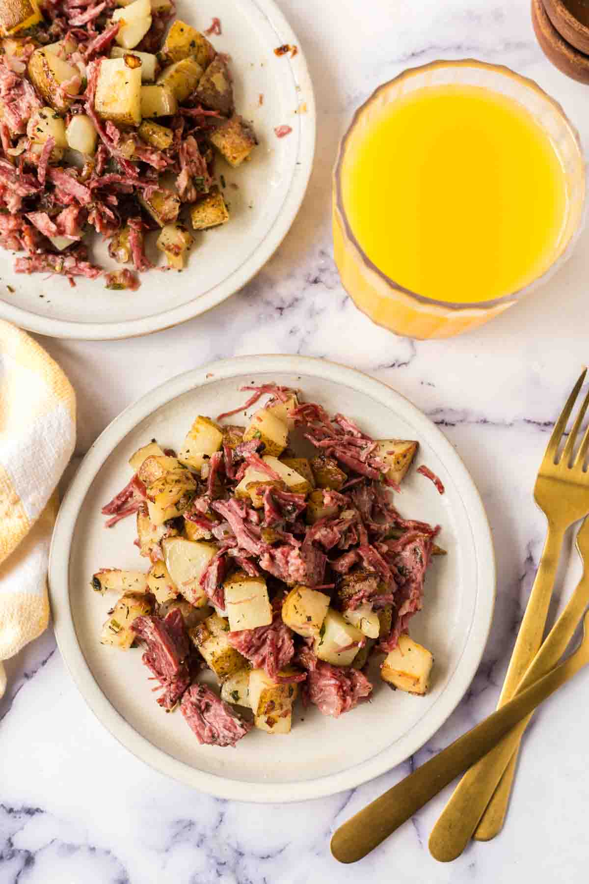 Top view of corned beef has served on a white plate.