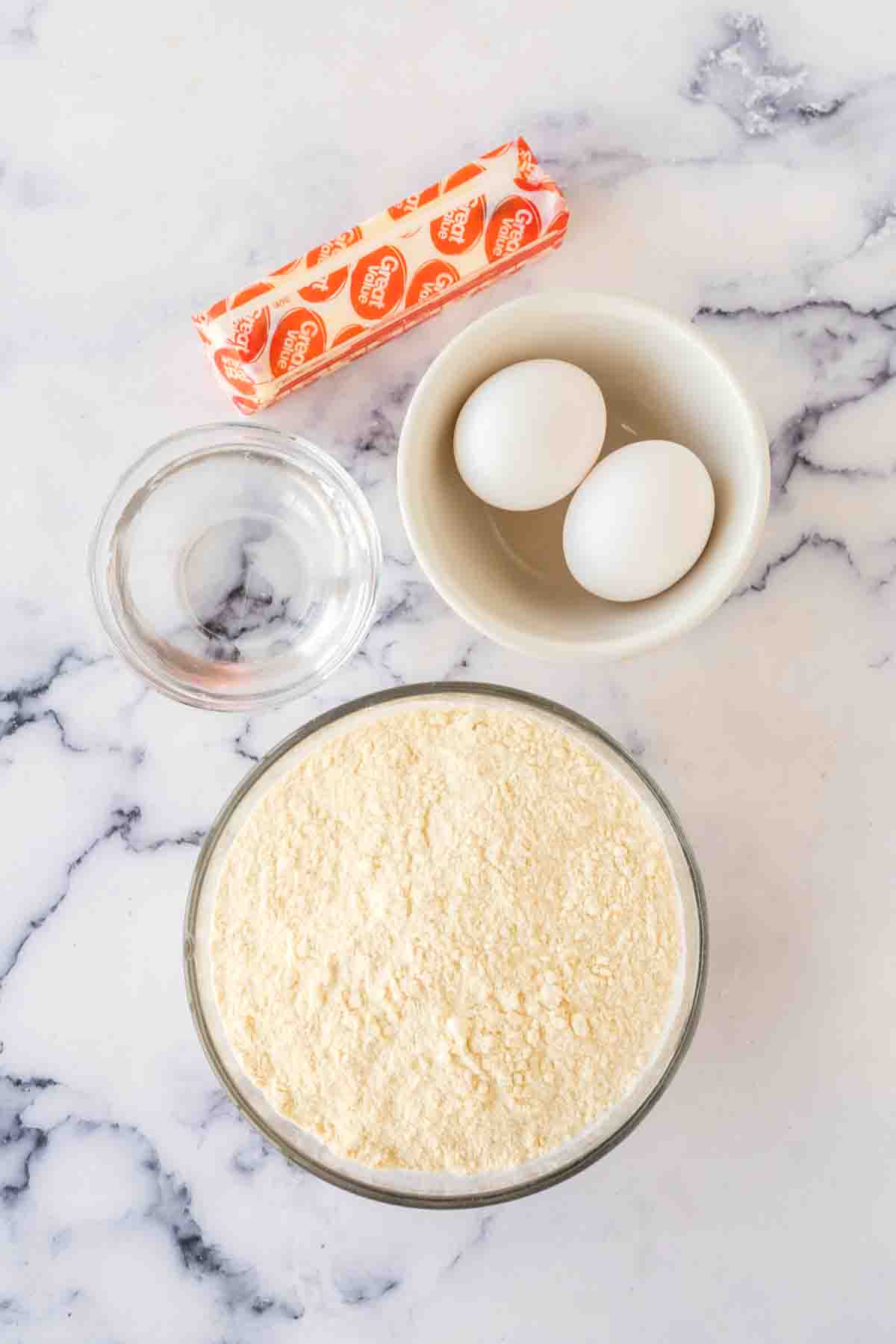 mixing bowl with ingredients for the empanada dough.