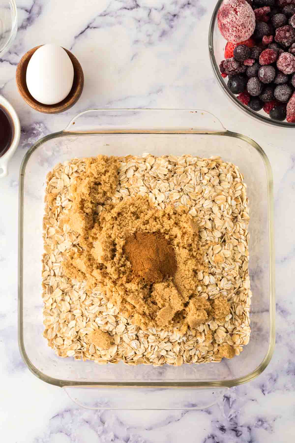 square clear casserole dish with baked oatmeal ingredients in steps