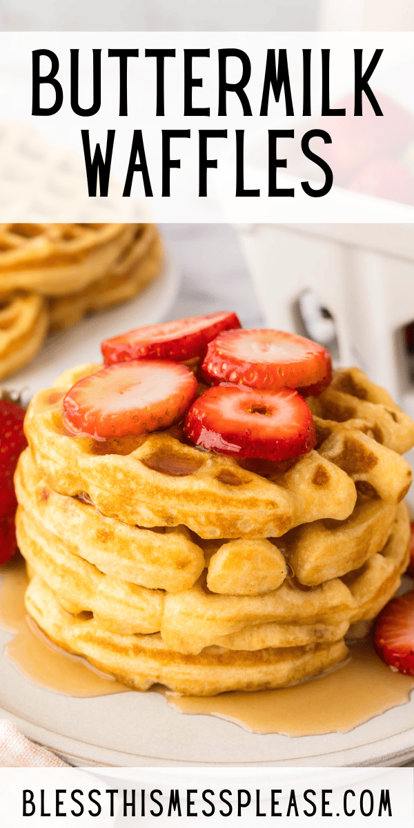 A stack of buttermilk waffles topped with sliced strawberries and syrup sits on a plate. The words Buttermilk Waffles are at the top, and is at the bottom.