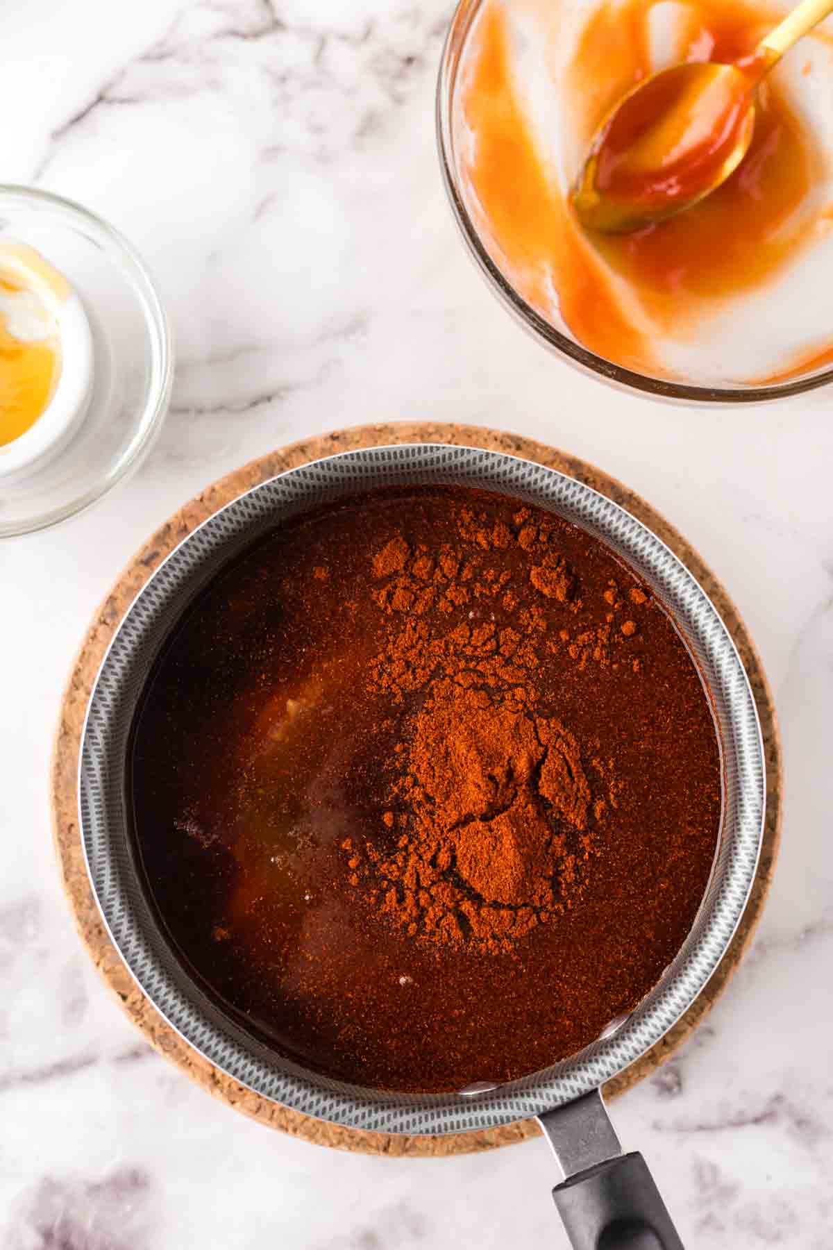 pot with barbecue sauce recipe boiling down in progress.