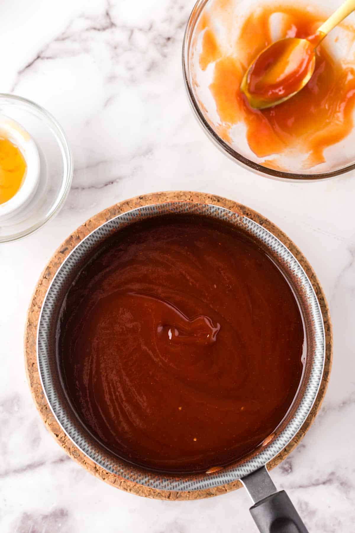 pot with barbecue sauce recipe boiling down in progress.