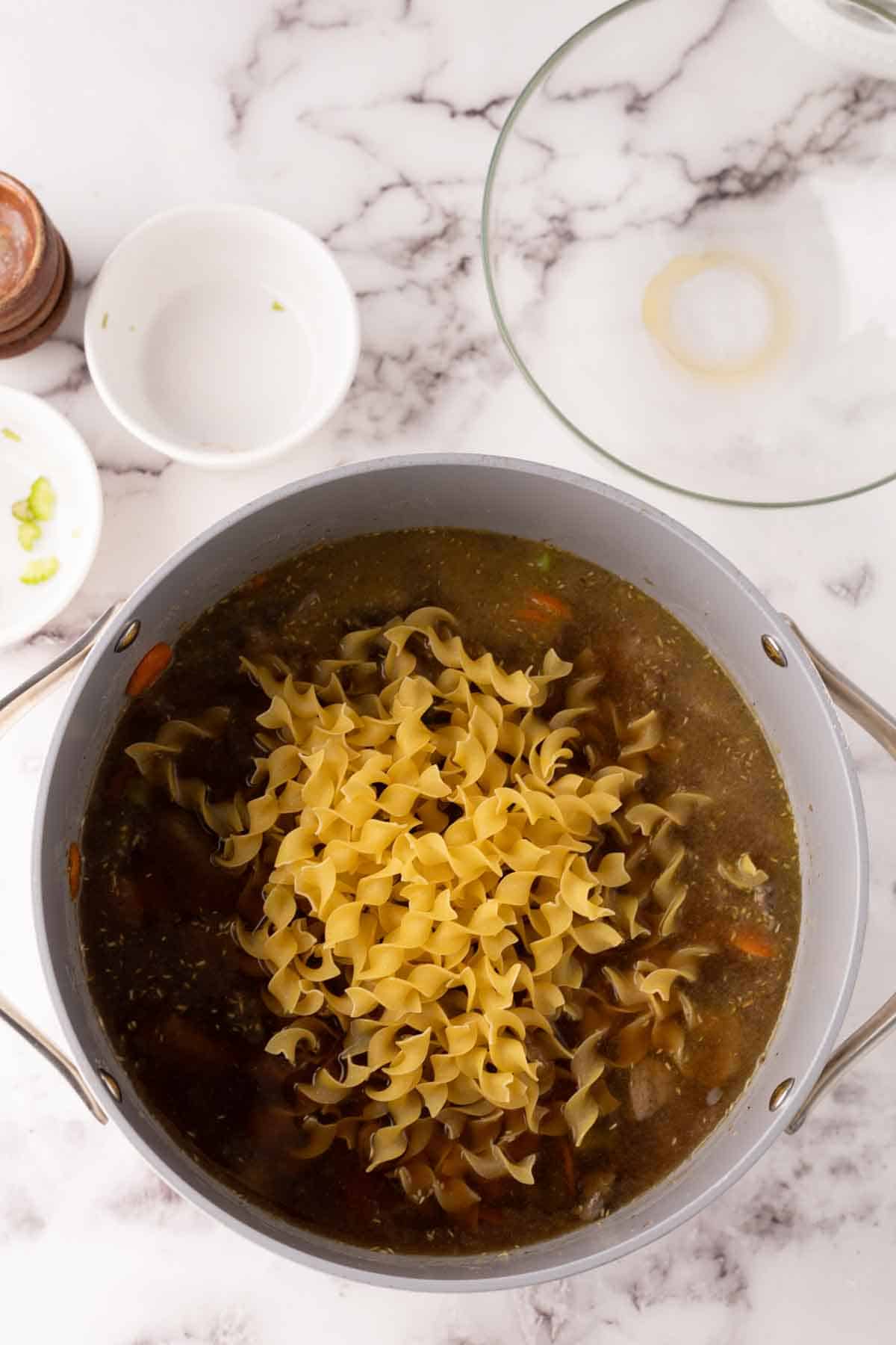process of the pot and other raw ingredients to make beef noodle soup.