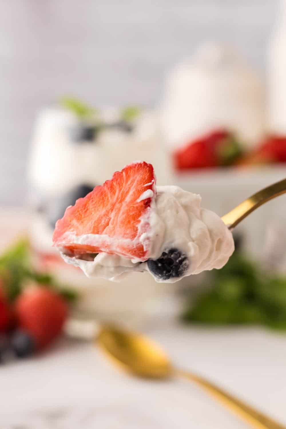 golden spoonful of berries and cream.