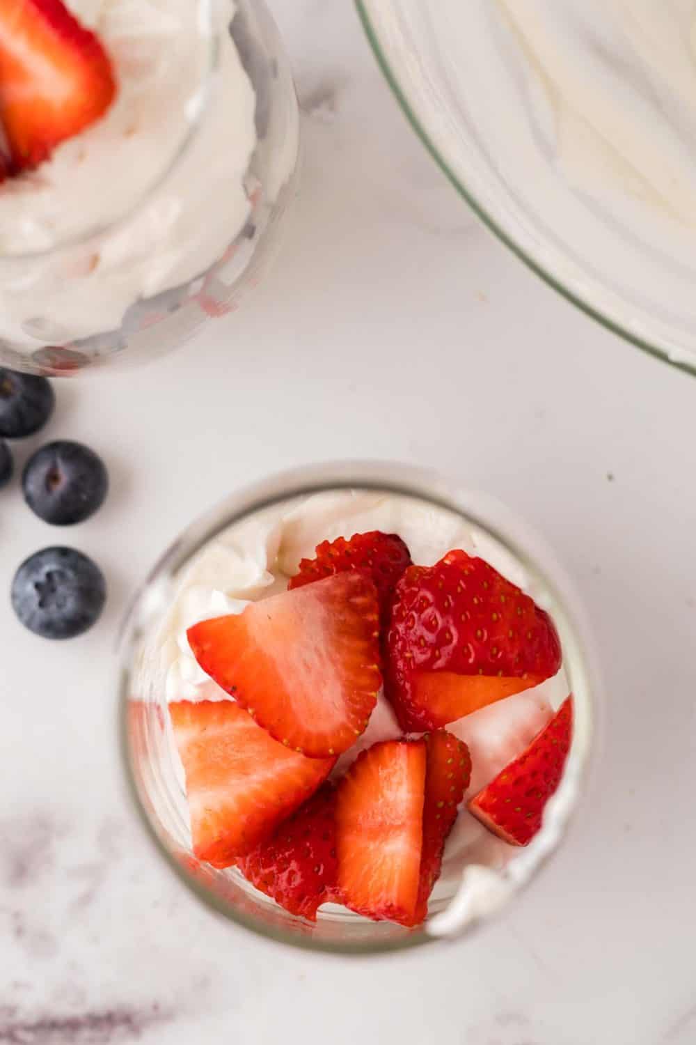 small mason jar with berries on top.