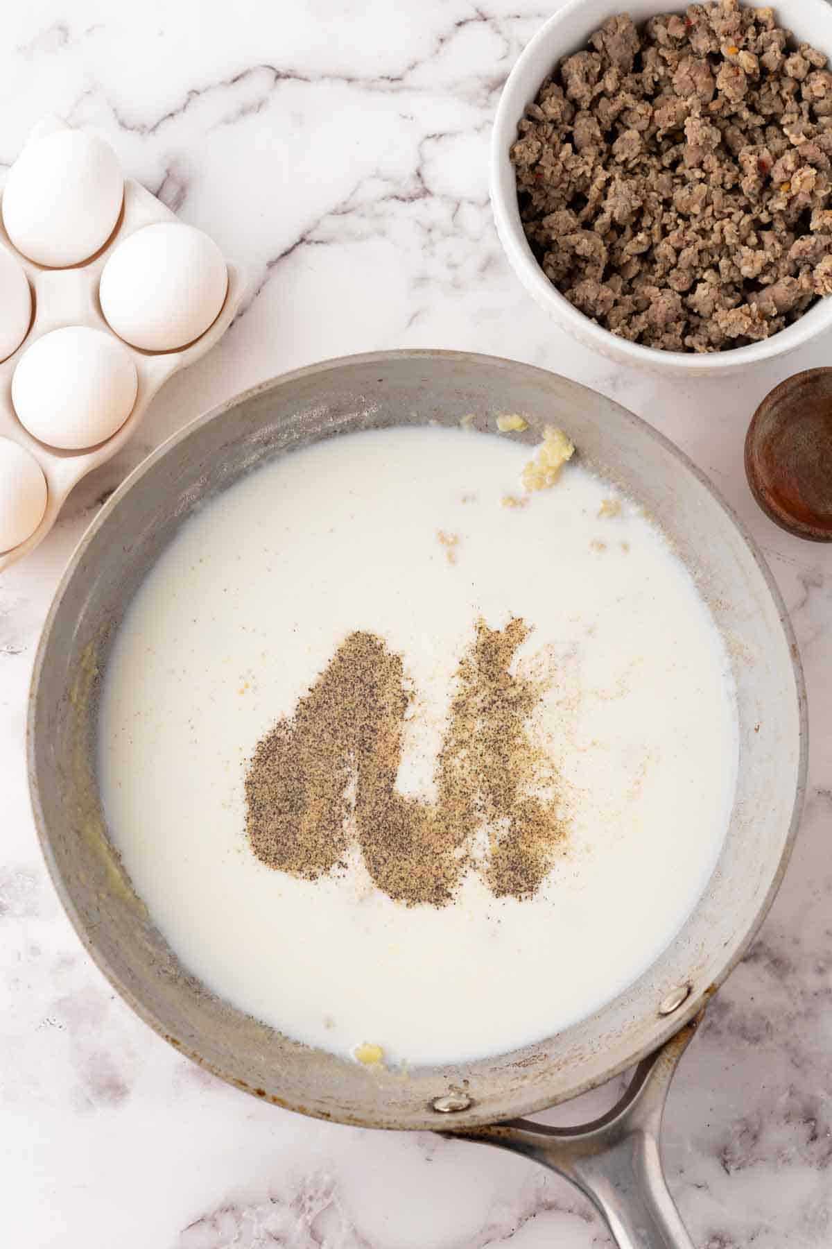 pot with the progress of making biscuits and gravy.