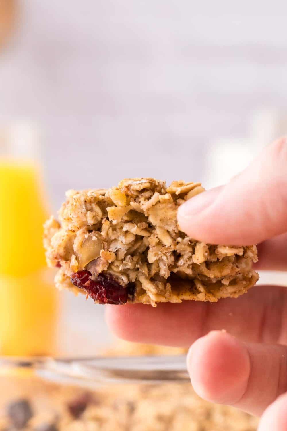 POV holding a square portion serving of breakfast bars.