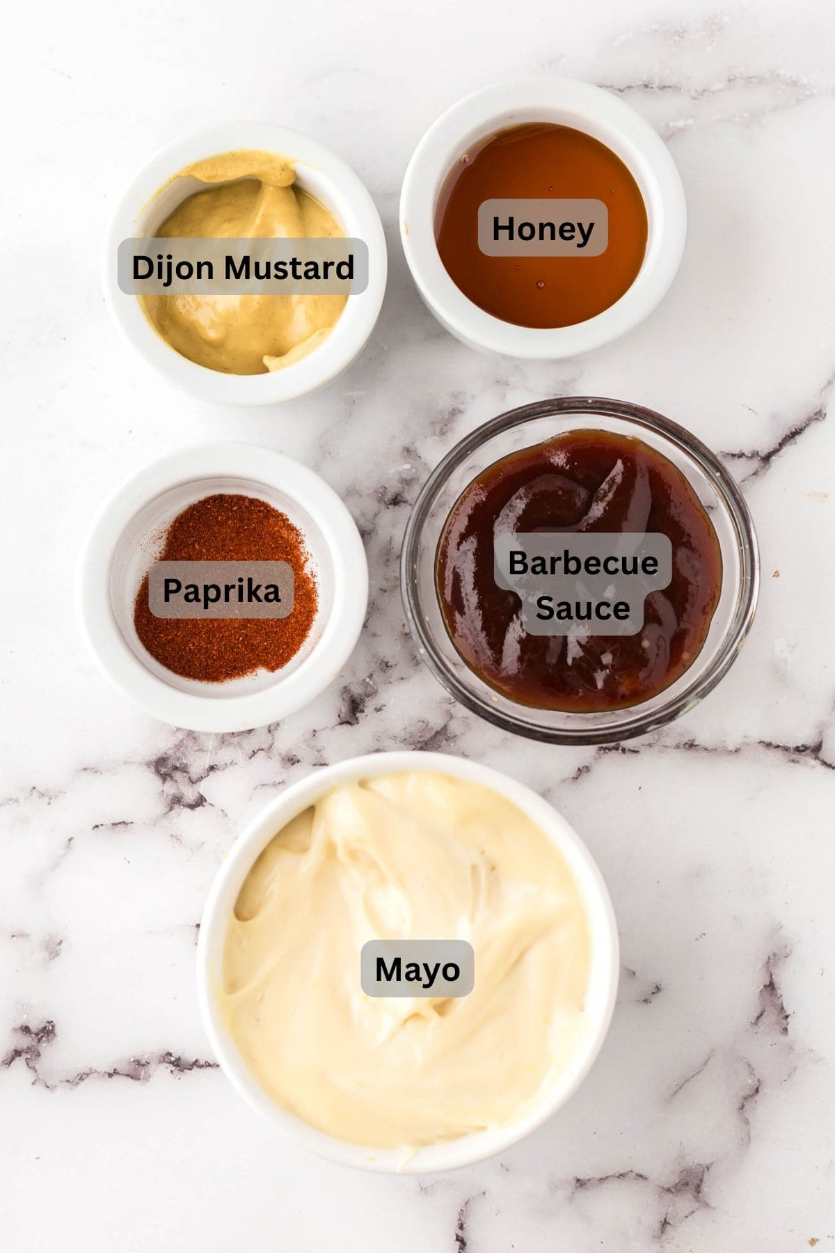 Ingredients for Chick-fil-a sauce in bowls and digitally labeled.
