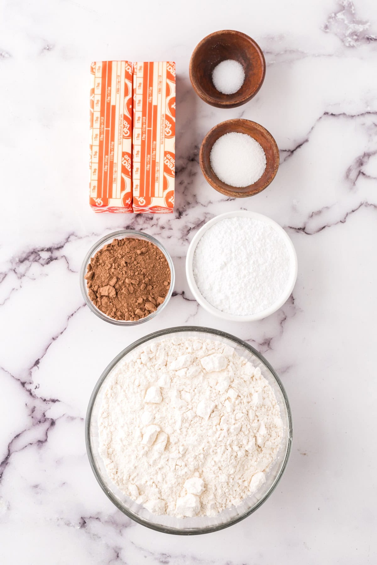portion bowls each with raw ingredients to make chocolate shortbread.