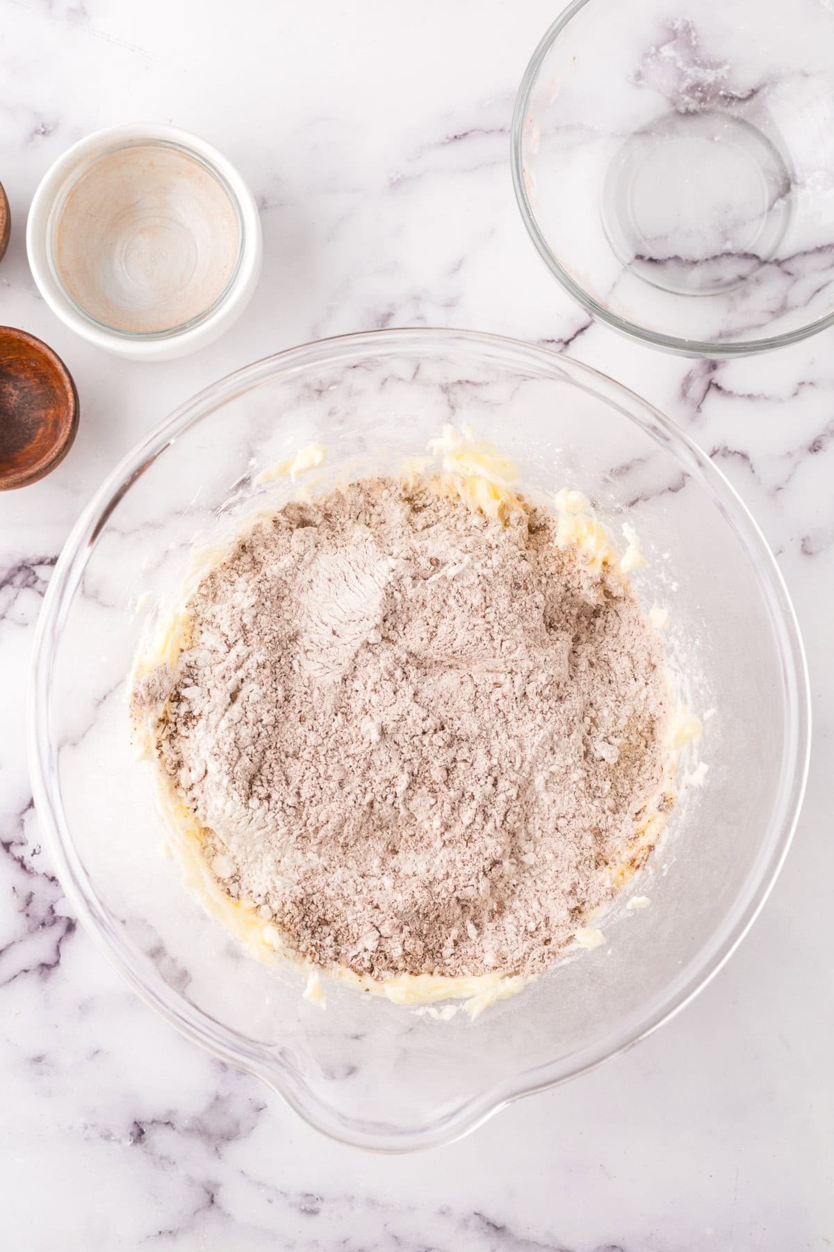 clear mixing bowl in the process of making the chocolate shortbread recipe.