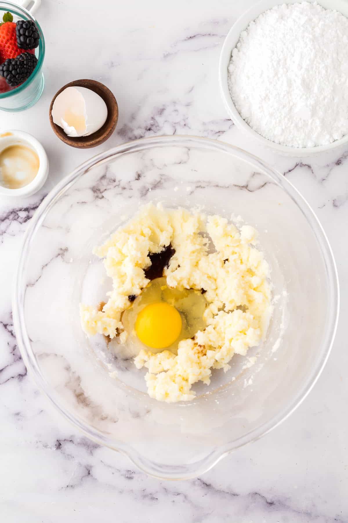 clear mixing bowl in the process of making fruit pizza cookie dough.