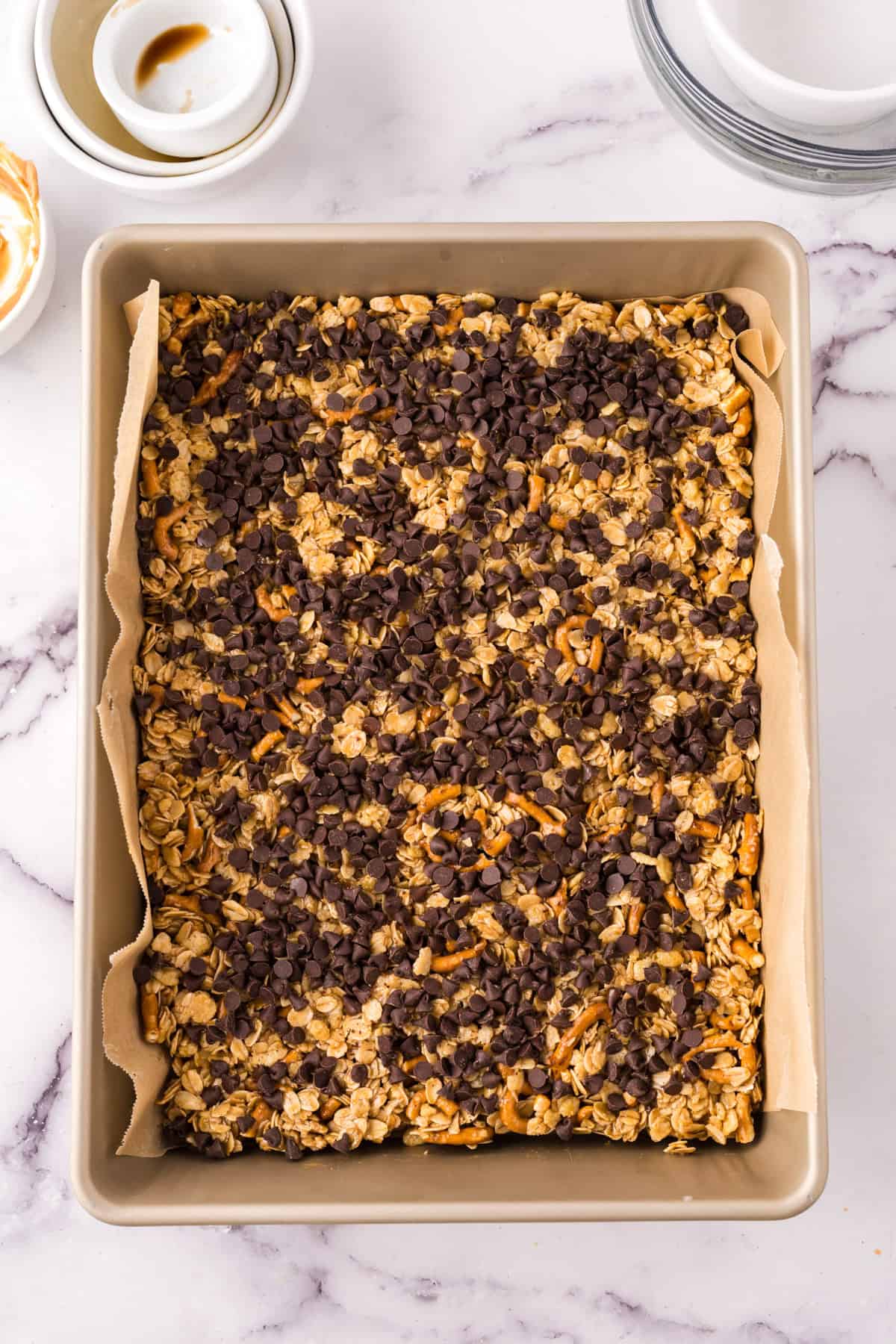 A baking dish with healthy homemade granola bars in it.