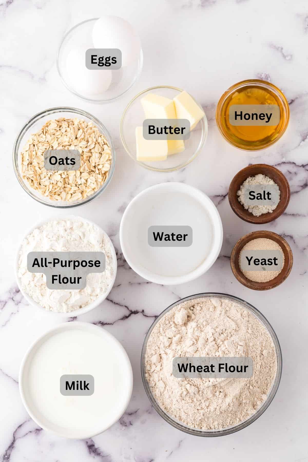 portion bowls each with digitally labeled raw ingredients to make whole wheat buns.