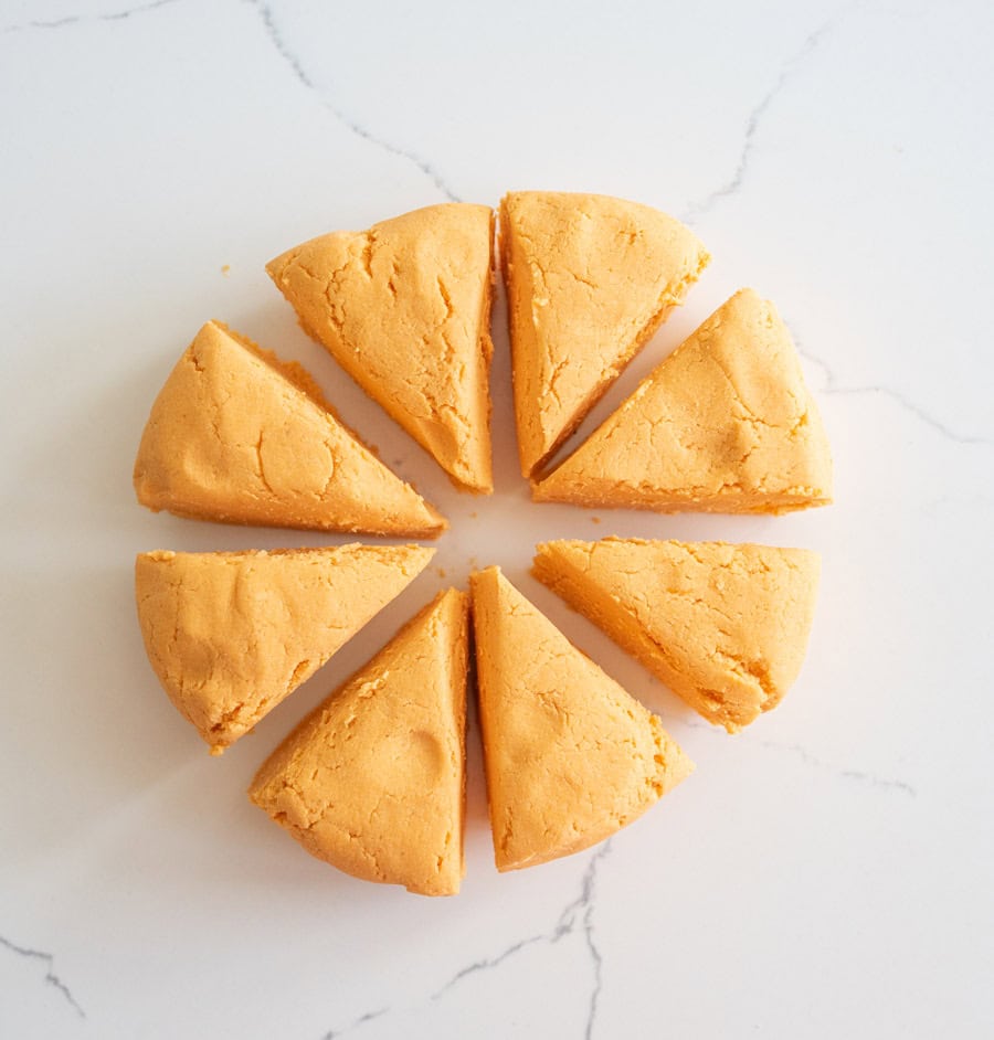 Cassava flour and sweet potato tortilla dough portioned into eight wedges.