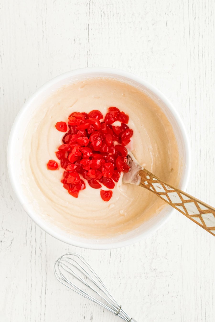 Homemade cherry chip cupcake batter in a mixing bowl.